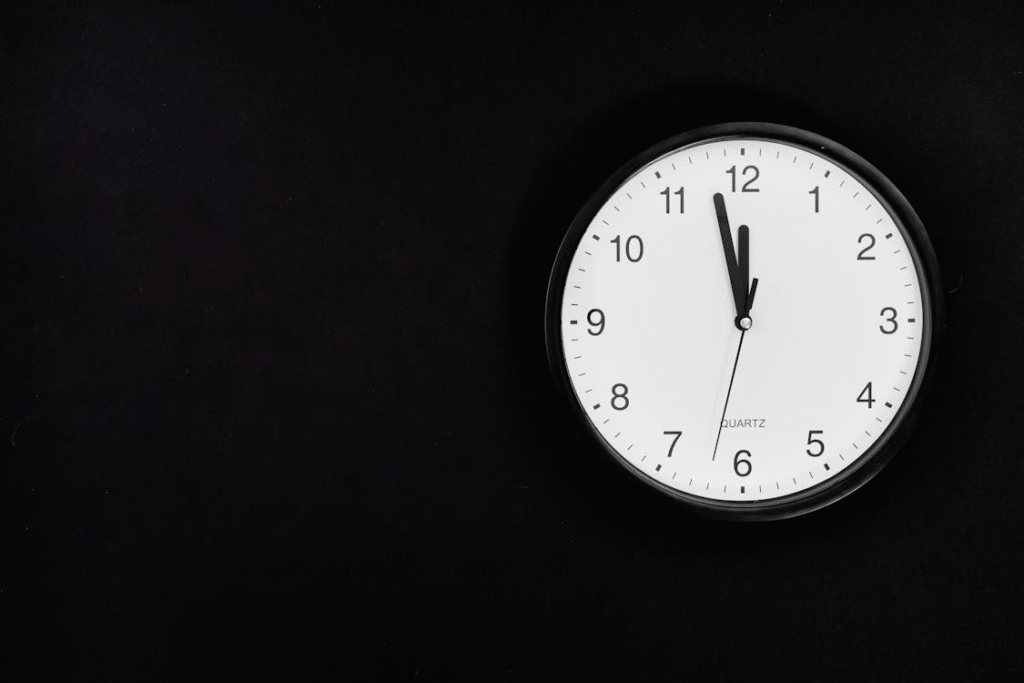 image of a clock against the pitch black background
