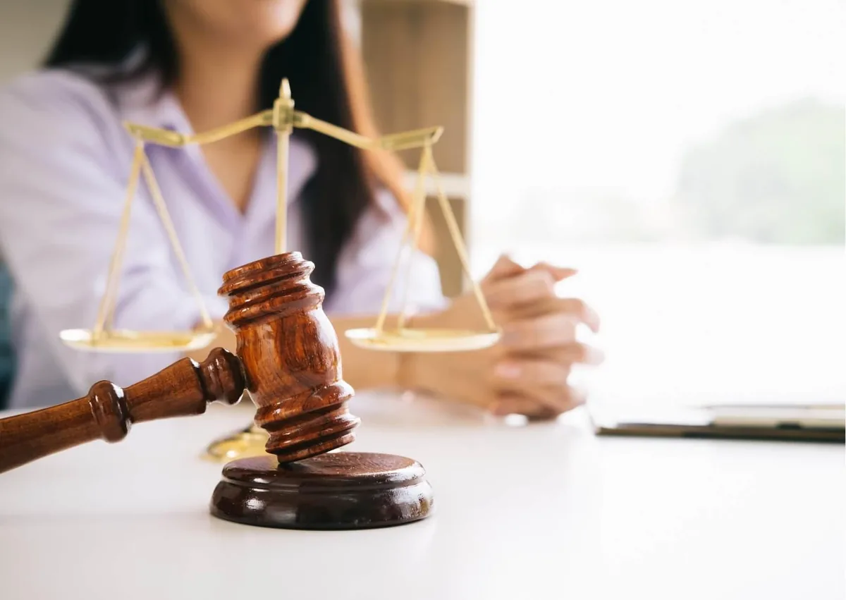 Judge’s gavel and scales of justice representing legal action and employee rights in workplace disability discrimination cases.